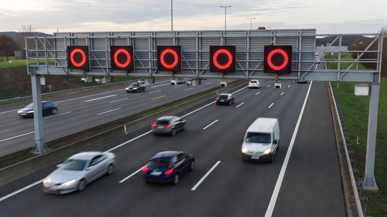 Overhead dynamic speed gantry on a European motorway displaying a variable limit